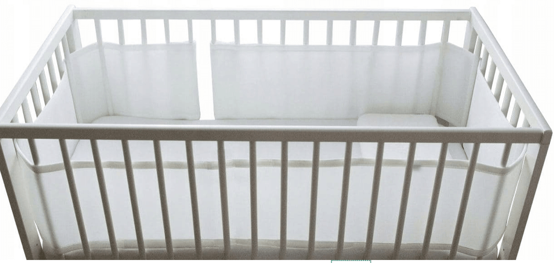 Baby Cot Bumper Half Length shown in a crib, featuring a stylish and safe design for infants.