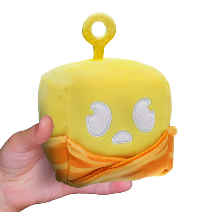 Blox Fruits Series 2 4" Collectable Plush featuring a cute yellow design with detailed embroidery in a person's hand.