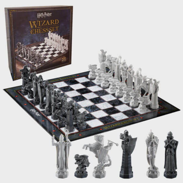 Harry Potter chess set displayed with a life-size wizard chessboard and finely detailed pieces, ideal for fans and gamers.