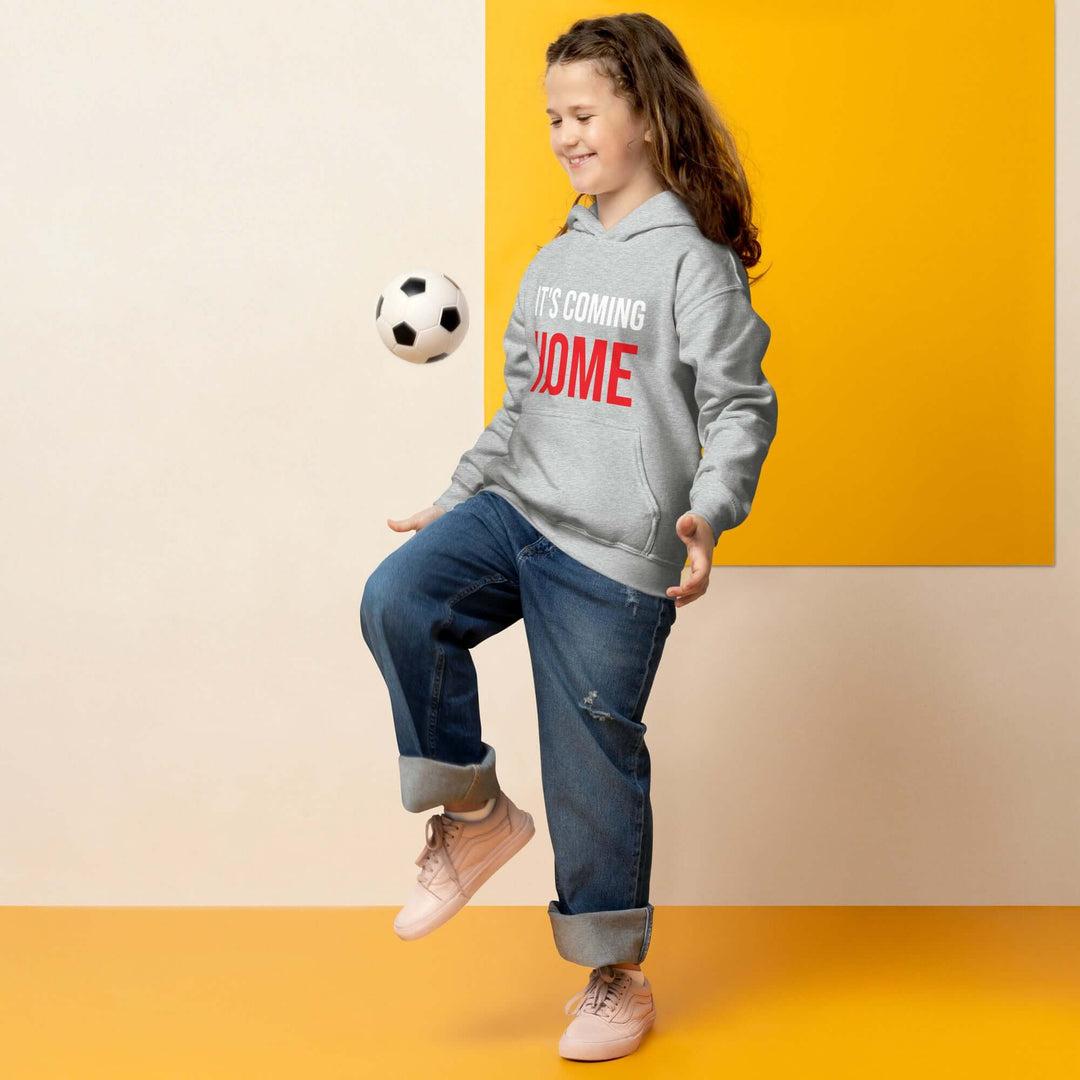 Child playing with a soccer ball wearing It&