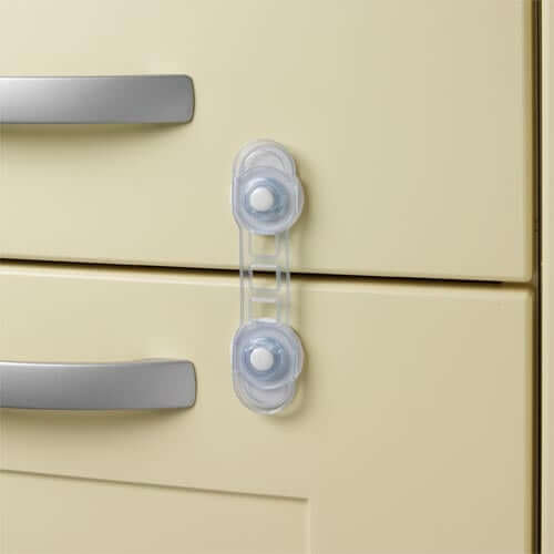 Mini Multi-Purpose Safety Latches on a cupboard to secure drawers and prevent child access.