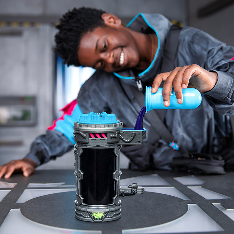 A child enthusiastically experiments with the MrBeast Lab Mutators Chamber - Stealth, pouring liquid into the device.