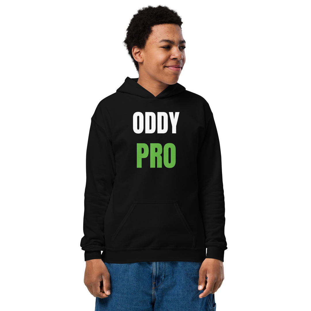 Boy wearing Oddy Pro youth heavy blend hoodie in black, featuring bold white and green lettering, perfect for active kids.