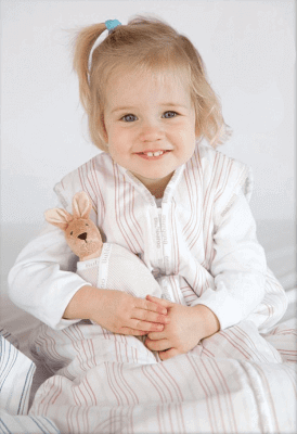 Joey Swag Baby Sleeping Bag - Lightweight &amp; Safe, baby girl smiling while holding a toy.